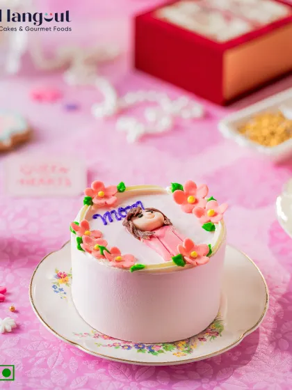 Small cake, big love. Our Mango Magic bento cake is made with sweet Alphonso mango and decorated with a fondant "Mom" topper, just for her.