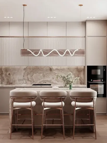 This view highlights the kitchen's unique pendant light and fluted panel details. The built-in oven and seamless cabinets create a clean, high-end look.