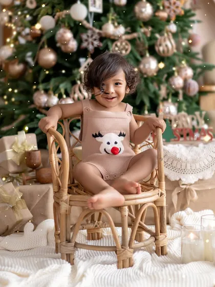 Merry Christmas! This little reindeer in front of a beautifully decorated tree is the cutest Christmas gift I've ever received.