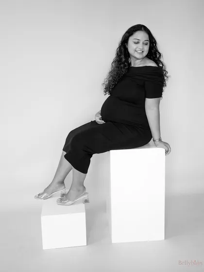 A lovely black and white portrait capturing her happy glow. The simplicity of the monochrome image makes her joy the absolute center of attention.