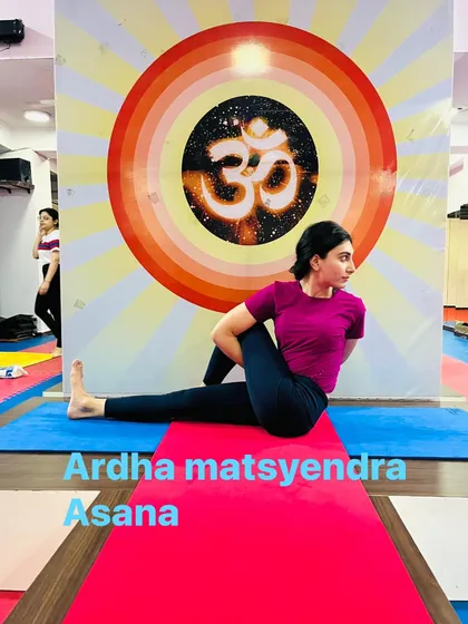 Ardha Matsyendrasana, or the Half Lord of the Fishes Pose. This spinal twist is excellent for improving digestion and releasing tension in the back.