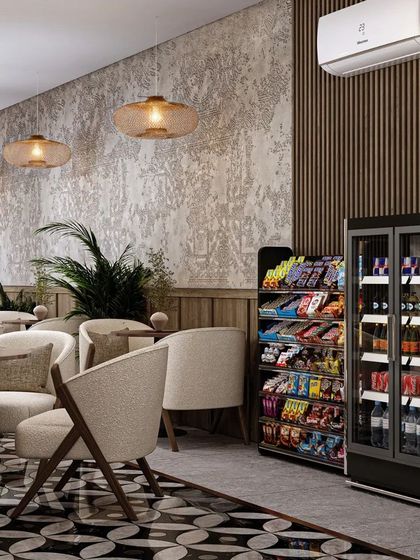 The cafe also includes a retail section for snacks and drinks, seamlessly integrated into the overall design.