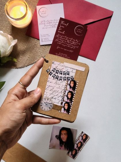 The cover of a mini birthday book, complete with a filmstrip of photos. It’s a small gift that makes a big impact, showing someone you took the time to create something special just for them.