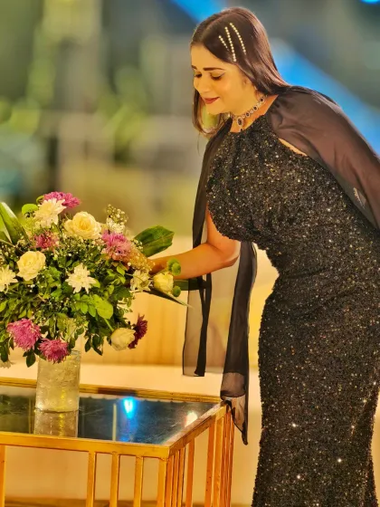 Adding a final touch to the decor before the guests arrive. I like to ensure every detail is perfect for the family, making their celebration as beautiful as they imagined.