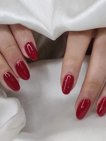 A deep, classic red gel manicure. This color is sophisticated and perfect for any season or occasion.