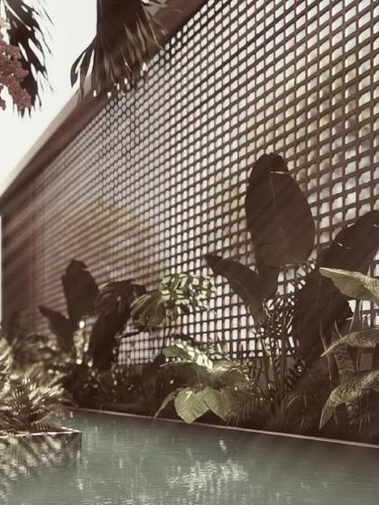 The kitchen in 'The Nest' vertical villa is a compact yet highly functional space. Integrated appliances and smart storage solutions maximize efficiency, while a large window brings in natural light and views.