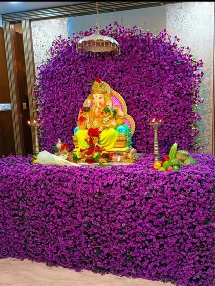 A sea of purple. This breathtaking Ganpati mandap is completely covered in fresh purple flowers, creating a rich, royal, and unforgettable devotional space.