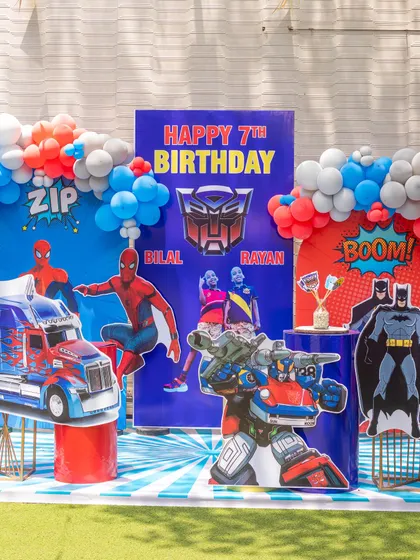 A close-up of our superhero and Transformers birthday backdrop. The dynamic graphics and character cutouts make for an epic photo spot for the birthday kids and their friends.