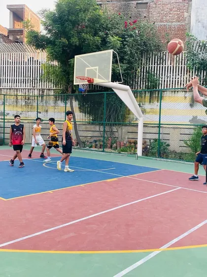A player jumps for a shot in the paint.