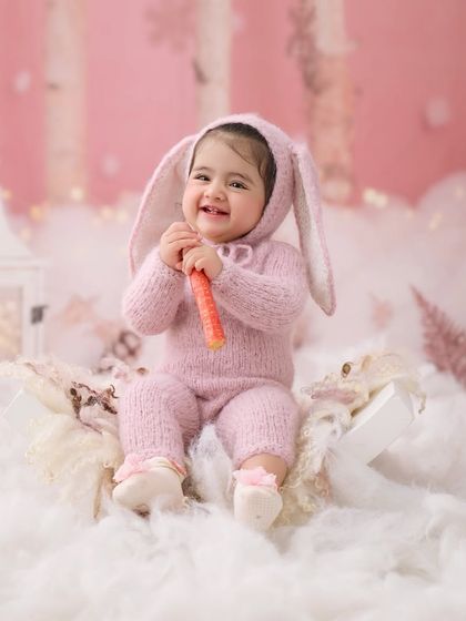 The cutest little bunny in a snowy forest. We have a variety of adorable animal costumes to make your baby's photoshoot extra special.