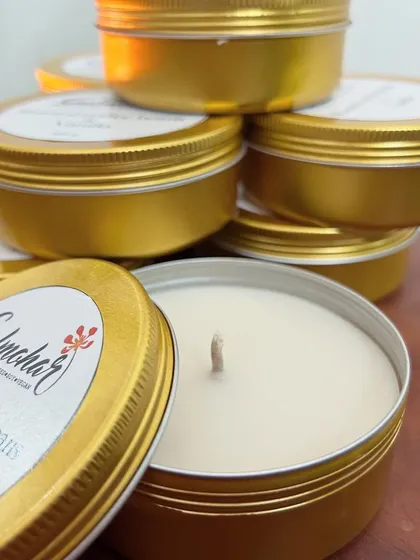 A stack of my coffee and vanilla tin candles. This is one of my most popular scents!