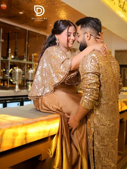 An engagement is a party, and I make sure to capture that celebratory energy. This couple, dressed in stunning gold outfits, shared a beautiful, candid moment of affection at their Roka ceremony.