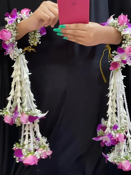 I design delicate and fresh floral jewellery for the bride, perfect for pre-wedding functions like Haldi and Mehndi. This set of kaleeras is made from orchids, roses, and baby's breath.