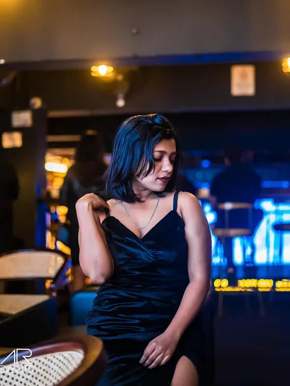 A guest posing in a velvet dress.