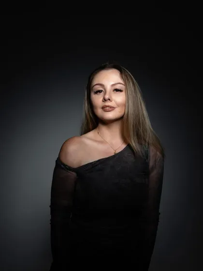 A moody, artistic portrait used for a mixtape feature, with a spotlight creating a dramatic effect.