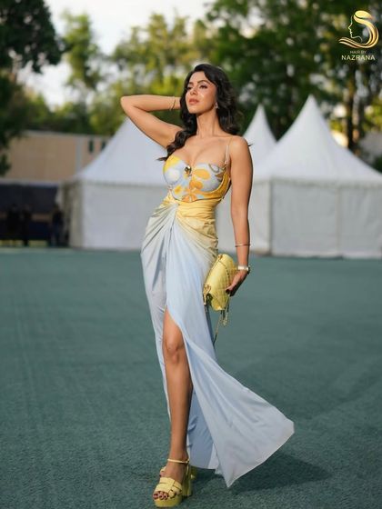 The wind catching her hair, showing the beautiful movement and texture of these beachy waves.