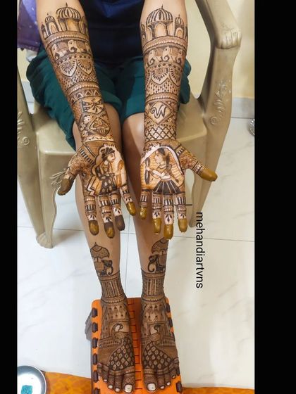 Another angle of the full bridal mehandi, showing how the story and patterns on the hands and feet create a complete artistic statement.