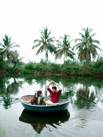 A playful moment during a pre-wedding shoot in the serene backwaters of Karnataka. I love finding unique settings like this coracle boat to bring out the fun and adventurous side of a couple's relationship.