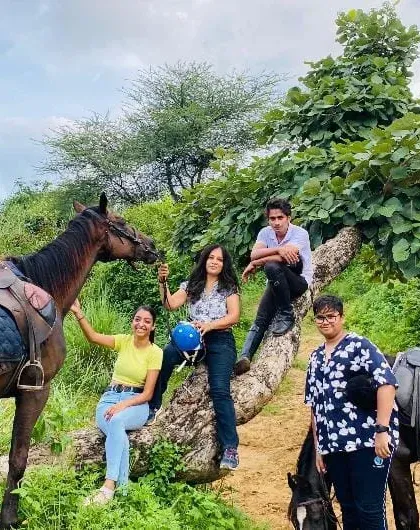 A group of friends pauses for a photo during their day out in the Aravali forest. Our rides offer plenty of opportunities to relax, chat, and enjoy the scenery together.