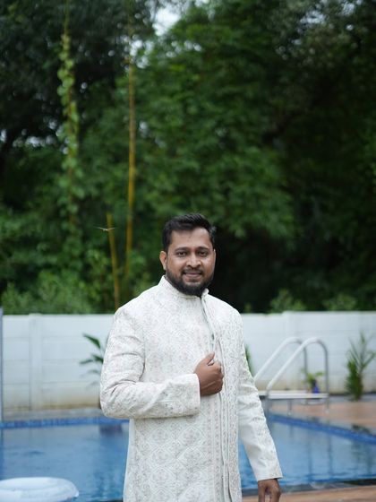 Another look at the off-white sherwani, showing the texture and fit. We make sure all our rental outfits are in perfect condition for your event.