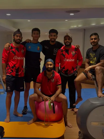 A candid moment with the players in the gym. These are the unseen hours that lead to victory.