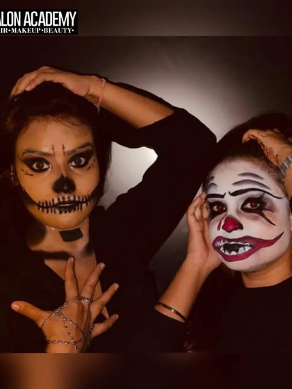 Students posing with their completed clown and skull fantasy makeup. These practical sessions are essential for building your portfolio with diverse and creative work.