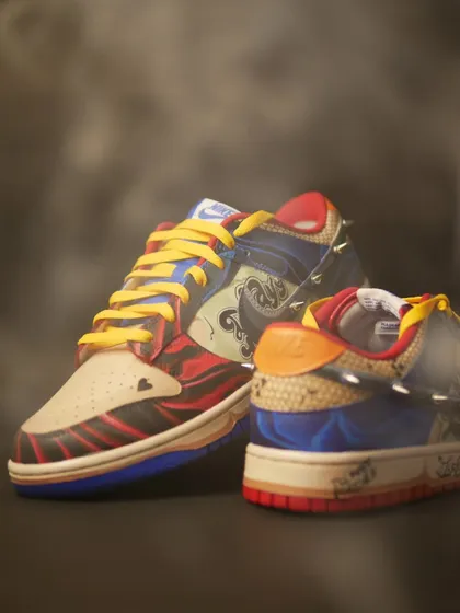 Another moody shot of the Harley Quinn custom Dunks. The colors, textures, and spikes all work together to create a really unique piece.