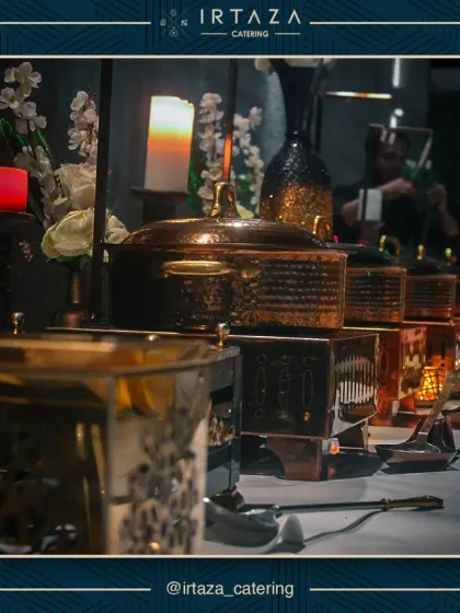 A full view of a buffet line featuring my hammered copper chafing dishes. This setup demonstrates how I use varying heights and textures to create a visually dynamic and appealing food display for large events.