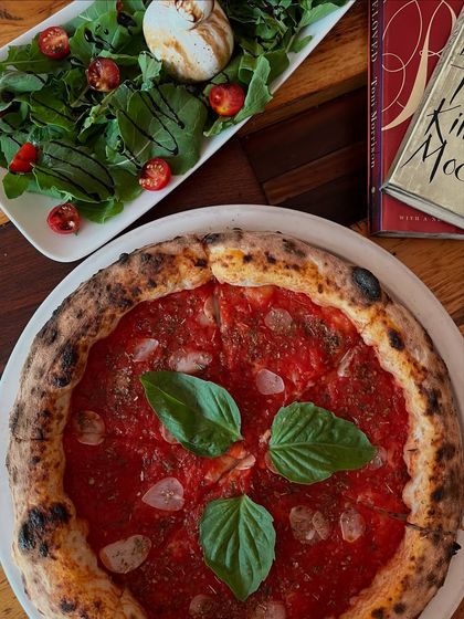 The pizza edit you didn't know you needed. Our Marinara pizza paired with a fresh salad is a light yet satisfying meal.