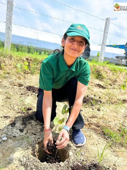 A member of our team demonstrates how to properly prepare the soil with compost before planting. This educational aspect of our drives empowers volunteers with practical gardening skills.