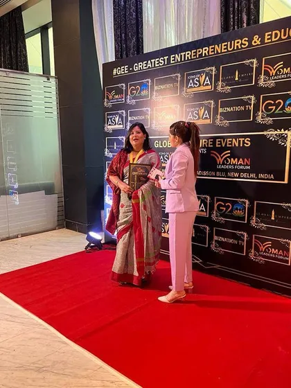 Receiving an award at the Woman Leaders Forum. I am grateful to be recognized for my efforts in skill development and encouraging women to find a balance between their career and family life.