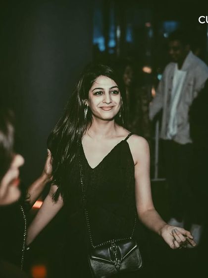 A guest dances with a smile, lost in the music. Creating a space for pure, joyful escapism is the essence of my club nights.