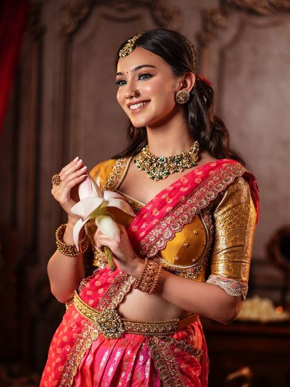 A serene and elegant look for this model, showcasing one of my classic half saree designs. The mustard yellow Kanchi blouse is paired with a pink brocade skirt and an embroidered dupatta.