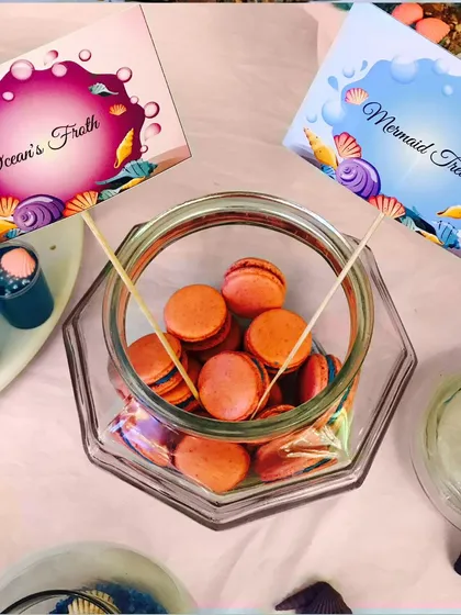 A jar of our colorful macarons, presented as "Mermaid Treats" and "Ocean's Froth" for an under-the-sea themed party.