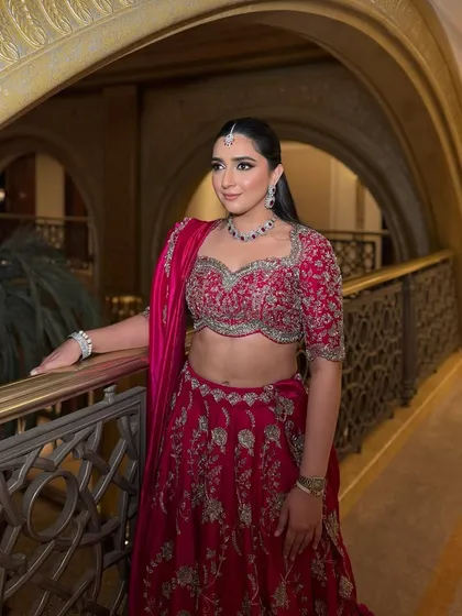 A side profile of this stunning Rani pink look, showcasing the flawless base and shimmery smokey eyes.