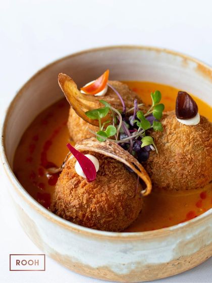 A bowl of our Tofu & Edamame Kofta. The crispy exterior gives way to a soft, flavourful interior, creating a wonderful textural contrast.