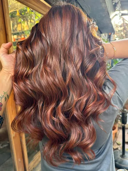 A close-up of the non-bleach copper tones. The hair looks incredibly healthy and shiny.