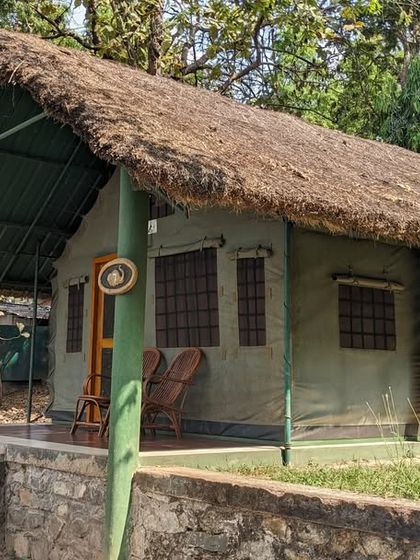 The tented cottages at Kali Adventure Camp provide a classic jungle stay experience, with a porch to relax on after a day of adventure.