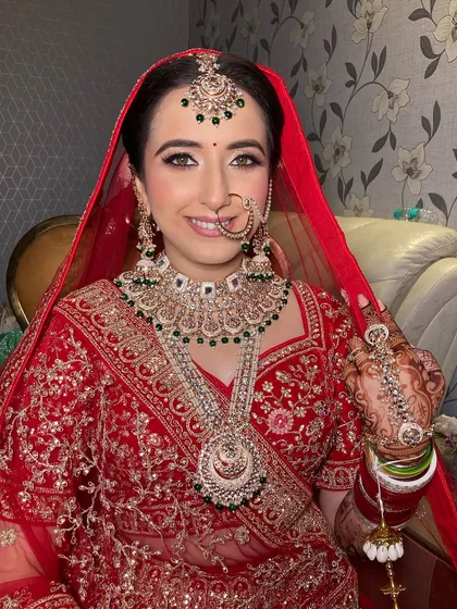 My lovely bride Vismita. I created a glamorous look with glittery eyes and a flawless base that made her shine on her special day.