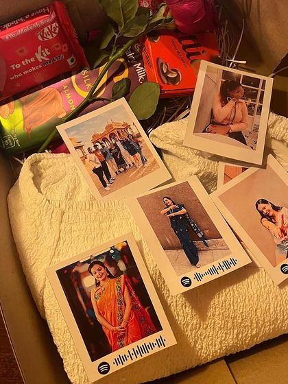 My custom prints shown as part of a larger gift box, surrounded by chocolates and a rose.