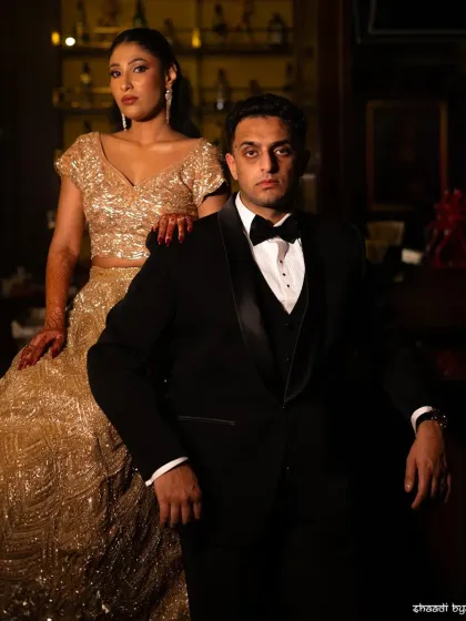 A powerful and elegant couple portrait. The formal attire and serious expressions give this shot a timeless, classic Hollywood feel.