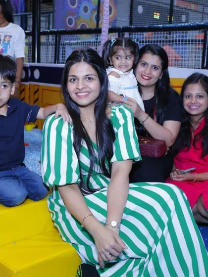 Moms and kids enjoying some downtime in the play area.