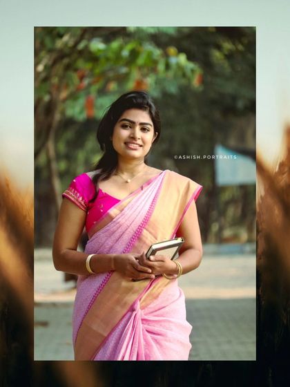 A full-length view of a classic saree look. The makeup is designed to be elegant and timeless, perfect for this light pink silk saree, suitable for daytime ceremonies or events.