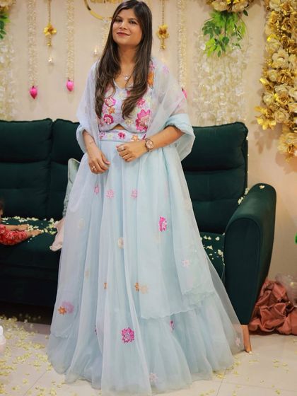 This soft blue pastel lehenga is a beautiful choice for the wedding season. The floral embroidery adds a touch of color, making it ideal for a bridesmaid or a wedding guest.