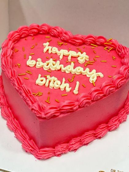 Another shot of the cheeky "happy birthday bitch!" heart cake.