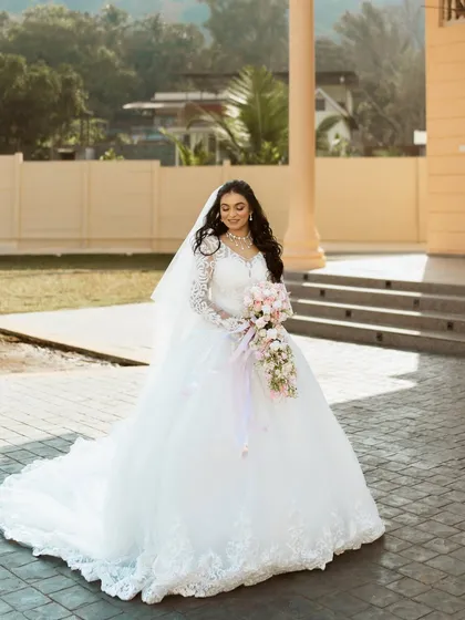 A full-length shot of the bride in her gorgeous princess-style gown.