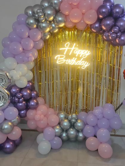 A full view of the 28th birthday setup, showing the complete balloon arch and foil number balloon.