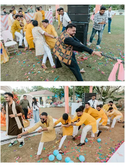 This wasn't a regular Haldi. We love when couples add their own twist, like this energetic tug-of-war between the bride and groom's sides. It's all about capturing the unique fun of your day.