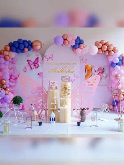 I love creating modern decor for traditional events like this Annaprashan, or rice ceremony. This elaborate butterfly theme uses multiple backdrops, custom butterfly wing cutouts, and a soft pink and lavender color scheme to create a magical setting.