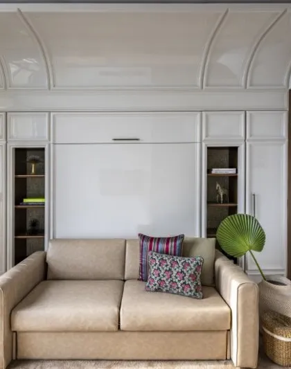 Art defines this Neo-Classical guest bedroom. A quiet still life of lemons becomes a bold statement, adding a touch of the unexpected to a traditional space.